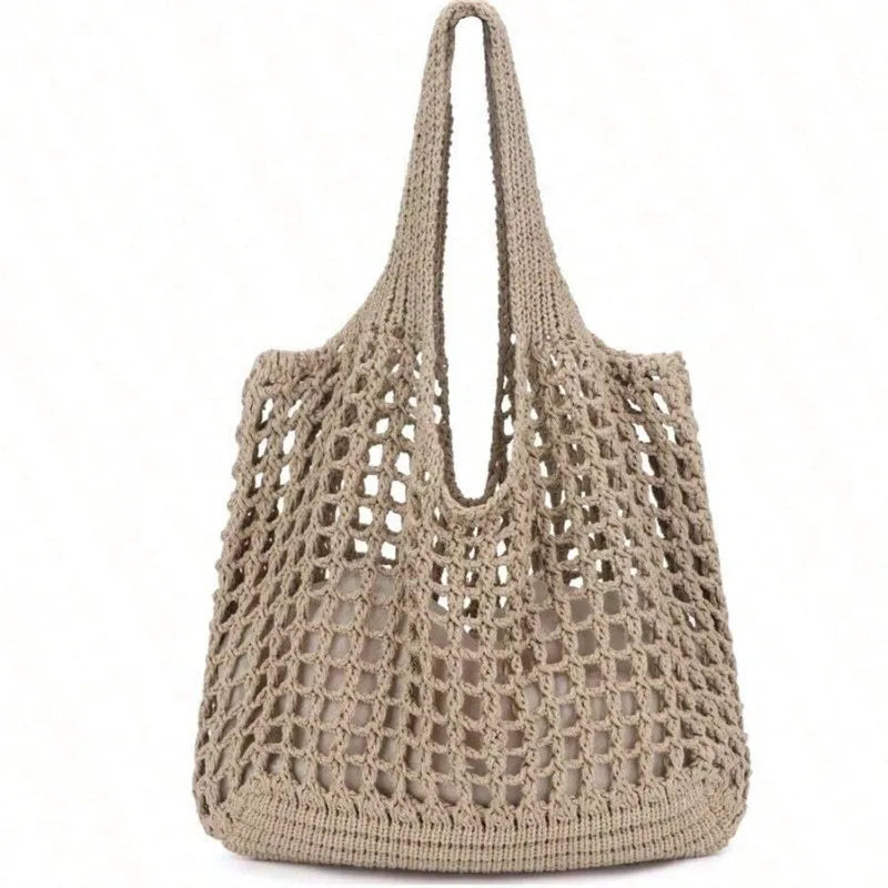 Bolsa feminina de crochê, leve e estilosa — perfeita para dias de sol, passeios e momentos na praia com muito charme e conforto.