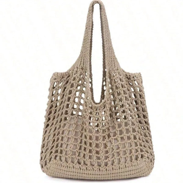 Bolsa feminina de crochê, leve e estilosa — perfeita para dias de sol, passeios e momentos na praia com muito charme e conforto.